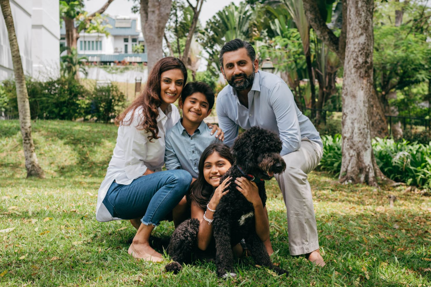 An image of Shireena Shroff Manchharam, founder of Getting To Happy™, and her family outdoors